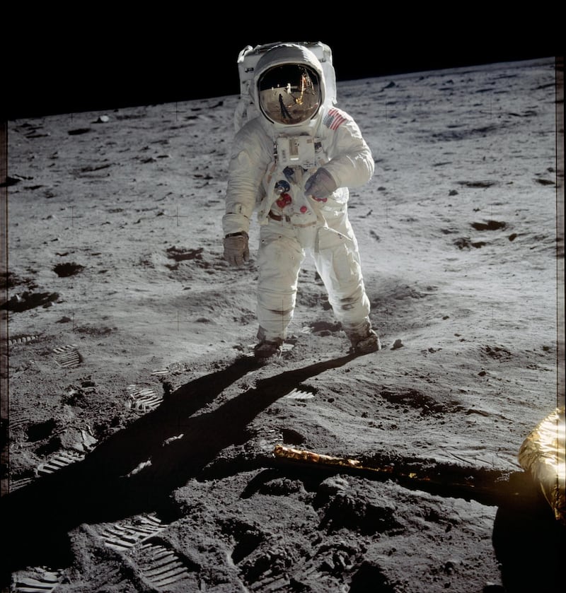 AL-7 series - Astronaut Edwin E. "Buzz" Aldrin, lunar module pilot, walks on the surface of the moon near the leg of the Lunar Module "Eagle" during the Apollo 11 extravehicular activity. Astronaut Neil A. Armstrong, commander, took this photograph. Courtesy Nasa