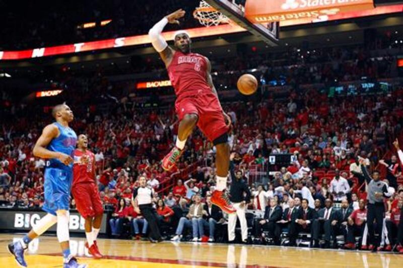 LeBron James dunks for Miami Heat against Oklahoma City Thunder on Christmas Day.