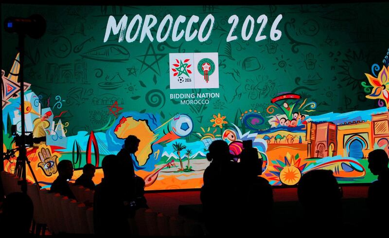 FILE - In this Saturday March 17, 2018 file photo, a giant screen display the logo of Morocco 2026 inside of the reception before a press conference to promote Morocco's bib for the 2026 soccer World Cup in Casablanca, Morocco. The North American bid to host the 2026 World Cup has outscored Morocco following inspections with FIFA labeling the North African proposal "high risk" in three areas, it was announced on Friday, June 1. The joint bid from the United States, Canada and Mexico scored four out of five while Morocco scored 2.7 following FIFA inspections. (AP Photo/Abdeljalil Bounhar, file)