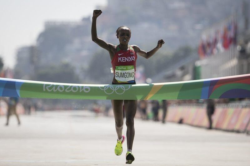 Jemima Jelagat Sumgong, of Kenya, celebrates as she crosses the finish line to win the gold medal in the marathon at the 2016 Summer Olympics in Rio de Janeiro, Brazil, Sunday, August 14, 2016. Felipe Dana / AP Photo