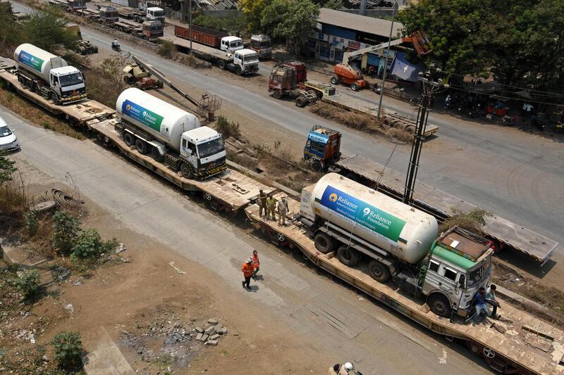 Oxygen tankers on board an 'Oxygen Express' train arrive in Navi Mumbai as India fights against a surge in Covid-19 cases.  AFP