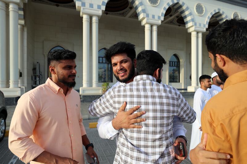 People greet each other after prayers. Chris Whiteoak / The National