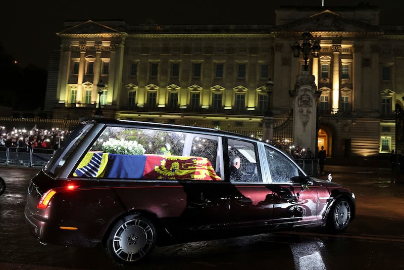The hearse carrying the coffin of Queen Elizabeth II arrives at Buckingham Palace in London, where it will rest overnight in the Bow Room. AP