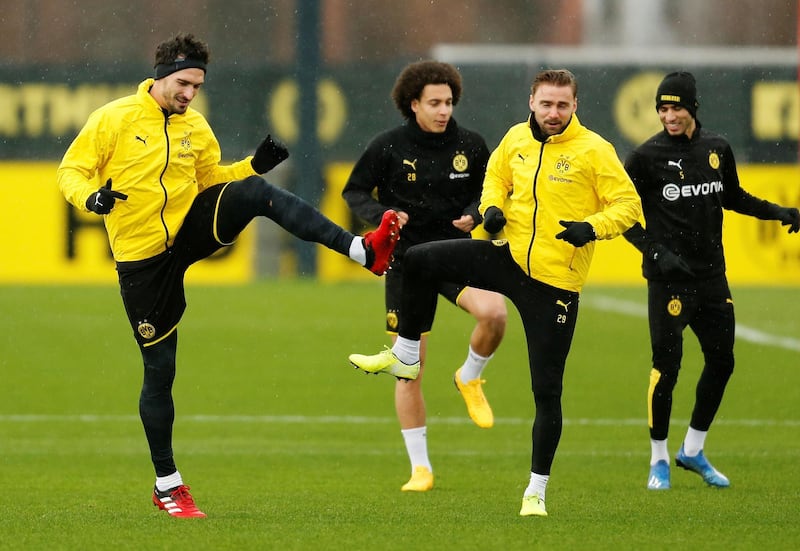 Borussia Dortmund's Mats Hummels, Axel Witsel and Marcel Schmelzer with teammates during training. Reuters