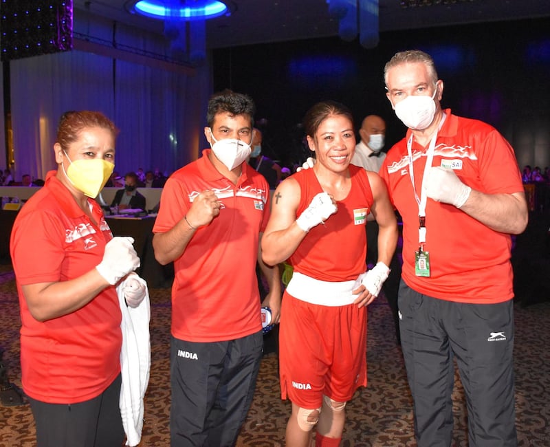 India's MC Mary Kom poses with the technical staff after her semi-final victory in the Asian Boxing Championships. Courtesy BFI