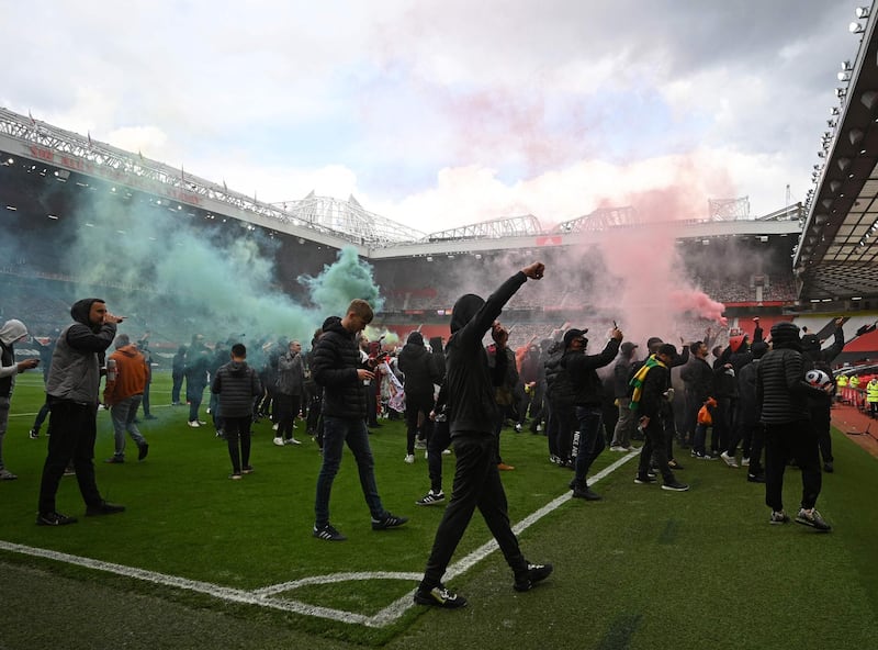 Supporters protest against Manchester United's owners - the Glazer family - inside Old Trafford. AFP