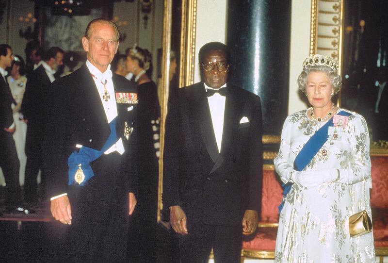 Mandatory Credit: Photo by Shutterstock (229453a)
Robert Mugabe, Queen Elizabeth II and PR PHILIP
QUEEN ELIZABETH II AND PRINCE PHILIP MEETING ROBERT MUGABE ZIMBABWEAN PRESIDENT - 1994