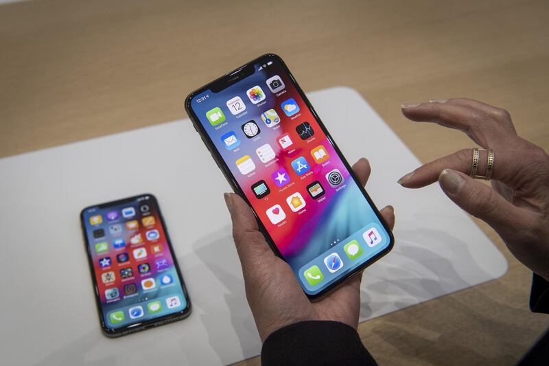 An attendee picks up the iPhone XS Max. David Paul Morris / Bloomberg
