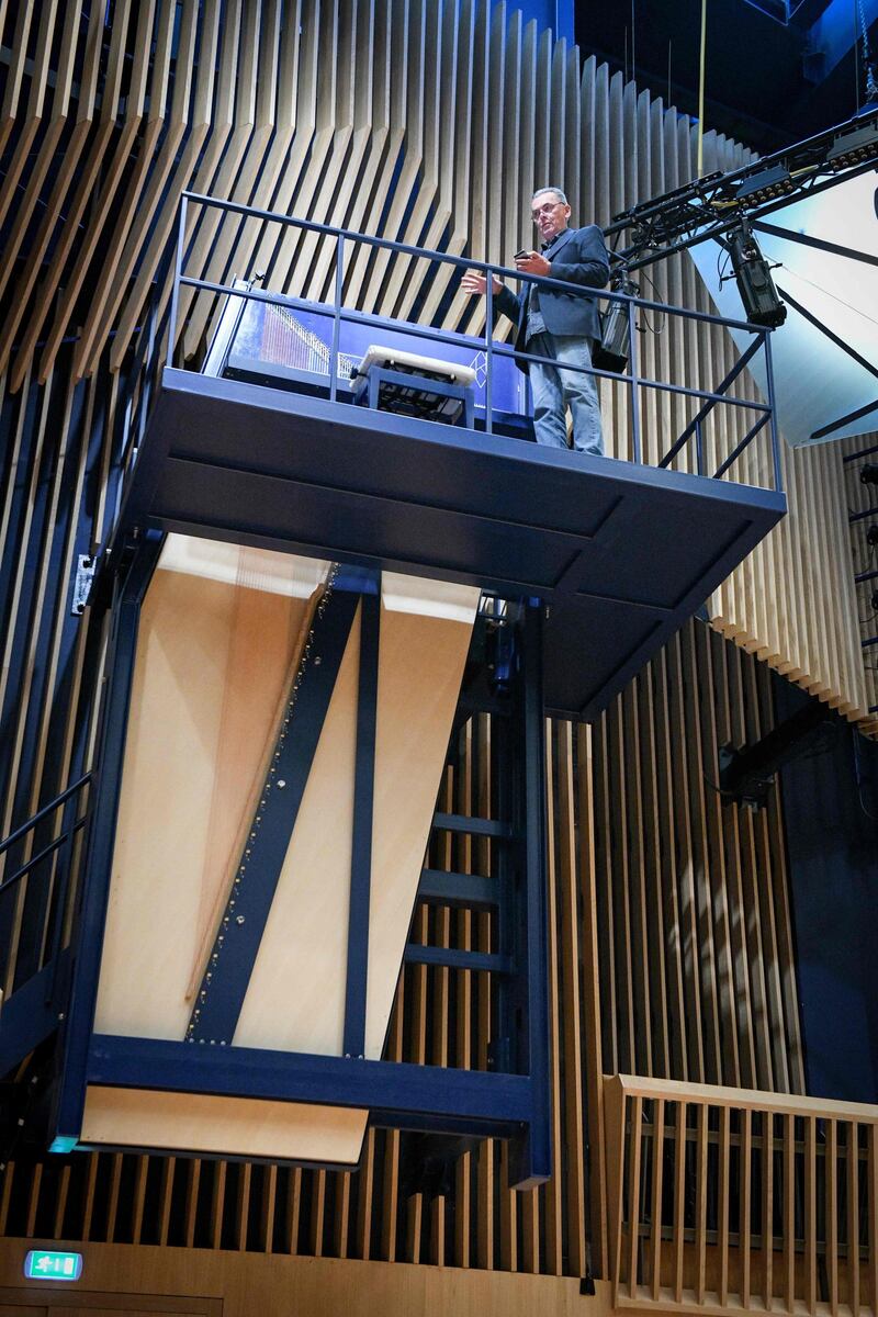 To reach the keys, pianists face a long uphill climb up a steep flight of steel stairs. AFP