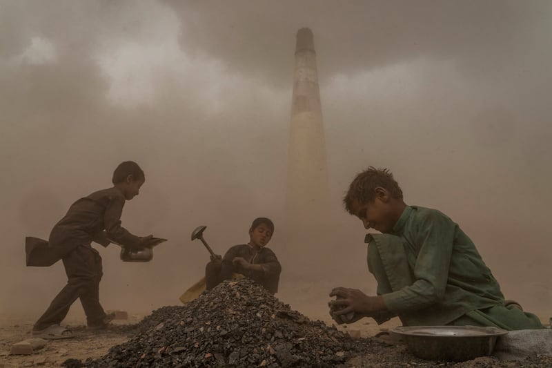 Afghan children work in a brick factory on the outskirts of Kabul, Afghanistan. Aid agencies say the number of children working in Afghanistan continues to grow since the economy collapsed following the Taliban takeover more than a year ago. AP Photo