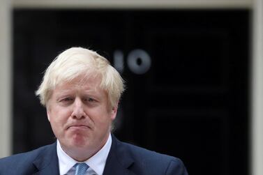 Britain's Prime Minister Boris Johnson reacts as he addresses the media outside Downing Street in London, Britain  REUTERS