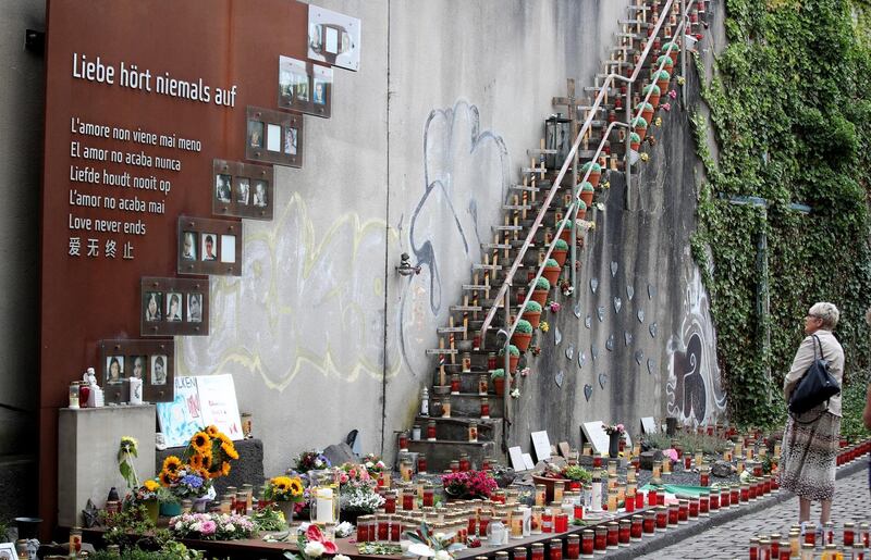 Gaby Mueller, the mother of a Christian victim who died at the age of 25 in the Love Parade 2010 disaster stands at the memorial site for the disaster's victims in Duisburg, western Germany.  EPA