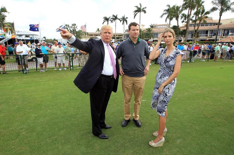 Gil Hanse, centre, has been tasked with designing the course for Trump International Golf Club, Dubai, the first foray into the Middle East by Donald Trump, left. David Cannon / AFP