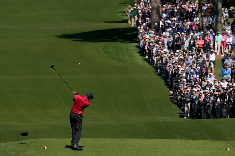 Woods hits his tee shot on the third hole during the final round at the Masters.  AP