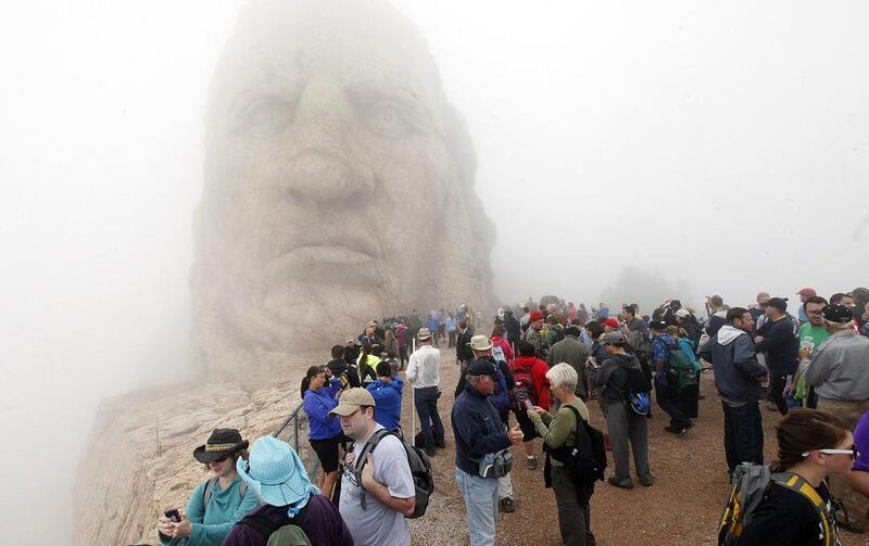 People gather in the fog at the Crazy Horse Memorial near Custer, S.D. for the annual Volksmarch. Chris Huber / AP