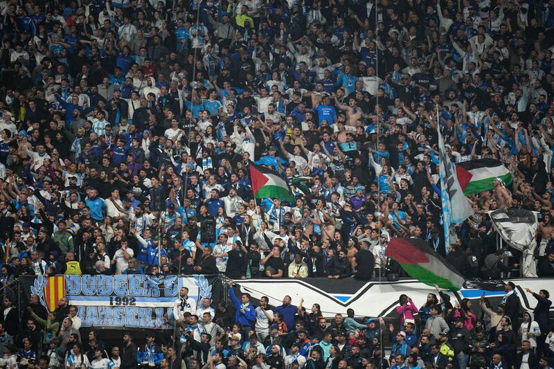 Marseille fans wait for the start of the French Ligue 1 match against Lyon at Stade Velodrome. The match was eventually postponed at Lyon's request. AP