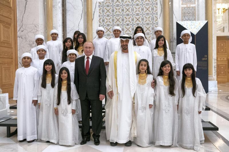 HH Sheikh Mohamed bin Zayed Al Nahyan, Crown Prince of Abu Dhabi and Deputy Supreme Commander of the UAE Armed Forces (front 4th R) and HE Vladimir Putin Vladimirovich, President of Russia (front 5th R), stand for a photograph with musicians, during a state visit reception at Qasr Al Watan.

( Hamad Al Kaabi / Ministry of Presidential Affairs )​
---