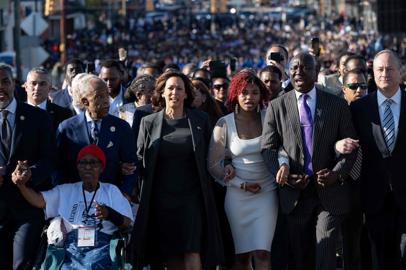 US Vice President Kamala Harris (2nd L), Second Gentleman Doug Emhoff (R), Civil rights attorney Ben Crump (2nd R) and the Reverend Al Sharpton (2nd L) join a march across the Edmund Pettus Bridge during a commemoration of the 59th anniversary of Bloody Sunday in Selma, Alabama, March 3, 2024.  On March 7, 1965, civil rights marchers crossed the Edmund Pettus Bridge and clashed with state police who used batons and tear gas to disperse the protesters.  (Photo by SAUL LOEB  /  AFP)