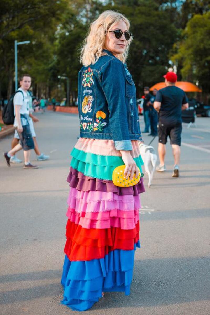 A woman flaunts a tiered skirt and denim jacket, which are undeniably inspired by – or knock-offs – of Gucci. Mauricio Santana / Getty Images
