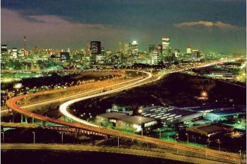 A view of Johannesburg at night. The South African utility Eskom plans to spend 385 billion rand up to 2013 to ramp up power production to prevent shortages. AFP
