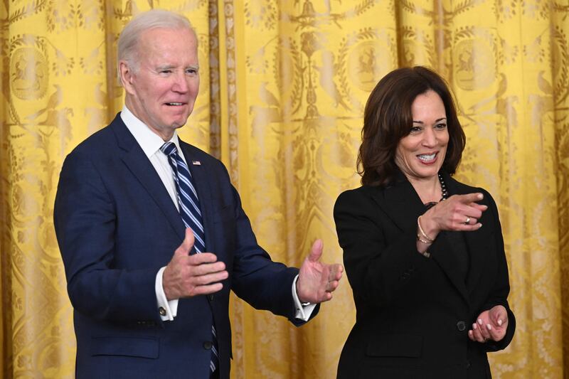 Mr Biden and Ms Harris gesture at the reception celebrating Black History Month. AFP