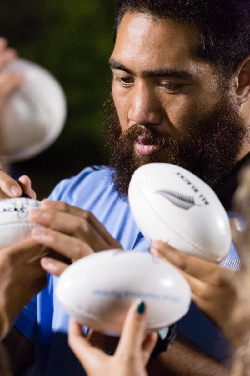 New Zealand's Charlie Faumuina signs autographs for the juniors on Tuesday night. Duncan Chard for the National
