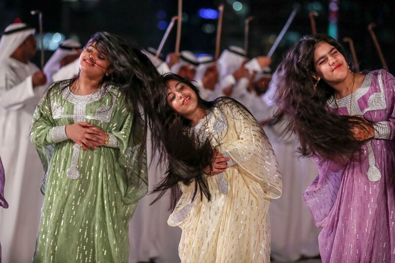 Al-Ayyala dancers move in unison to a drummed rhythm at Al Hosn Festival. Khushnum Bhandari / The National
