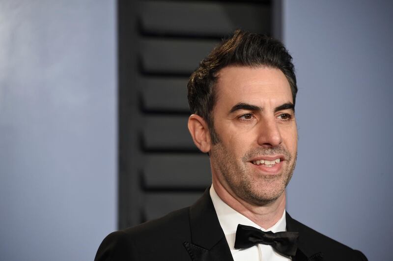 FILE - In this March 4, 2018, file photo, Sacha Baron Cohen arrives at the Vanity Fair Oscar Party in Beverly Hills, Calif. Some politicians are going through the several stages of panic associated with an interview with Cohen: remorse, damage control, anger and regret for being duped. One of the comedian's latest targets, defeated Senate candidate Roy Moore, is threatening a defamation lawsuit over an upcoming episode of the comedian's new television series. (Photo by Evan Agostini/Invision/AP, File)