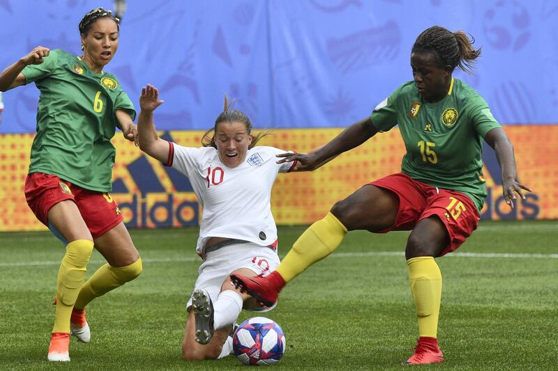 England's forward Francesca Kirby (C) vies with Cameroon's defender Estelle Johnson (L) and Cameroon's defender Ysis Sonkeng during the France 2019 Women's World Cup round of sixteen football match between England and Cameroon, on June 23, 2019, at the Hainaut stadium in Valenciennes, northern France. (Photo by Philippe HUGUEN / AFP)