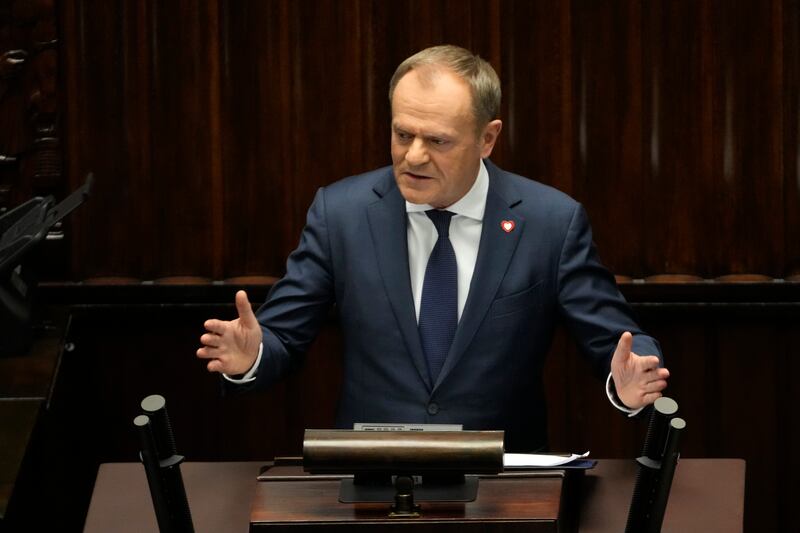Poland's newly elected Prime Minister Donald Tusk addresses politicians in parliament in Warsaw. AP
