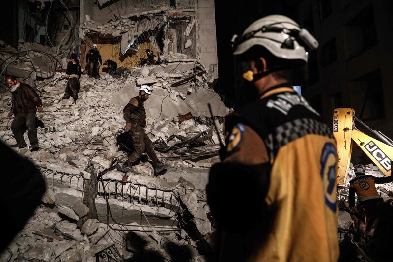 Syrian civil Defence volunteers search for survivors following an explosion in the rebel-held city of Idlib. Sameer Al-Doumy / AFP