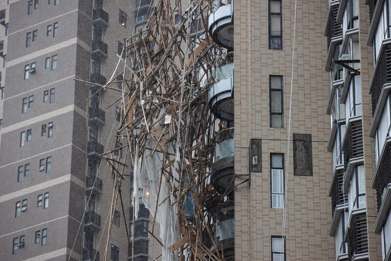 Collapsed scaffolding on residential building in Hong Kong.  A worker died and three others were rescued by emergency personnel after the scaffolding gave way under the onslaught of rain and wind brought by Typhoon Lionrock. EPA