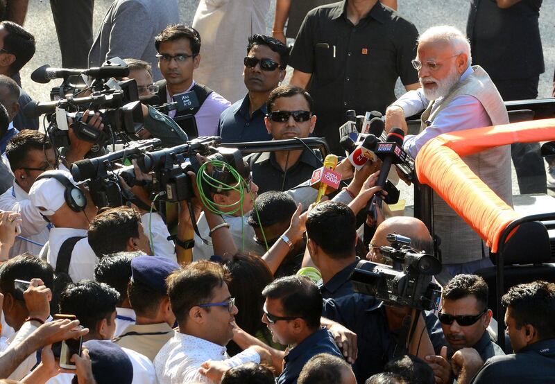 Indian Prime Minister Narendra Modi speaks to media after casting his vote during the third phase of general elections at a polling station in Ahmedabad on April 23, 2019. Some 190 million voters in 15 states are eligible to take part in the polls on the third of seven days of voting in the world's biggest election. / AFP / SAM PANTHAKY
