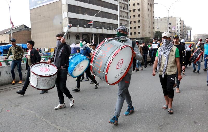 Iraqi protesters beat on the drums during a protest at the Al-khilani square in central Baghdad, Iraq.  EPA