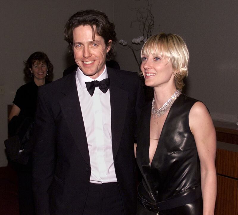 Hugh Grant and Anne Heche attend the Warner Brothers/ 'InStyle' party after the 58th Annual Golden Globe Awards in 2001. Reuters
