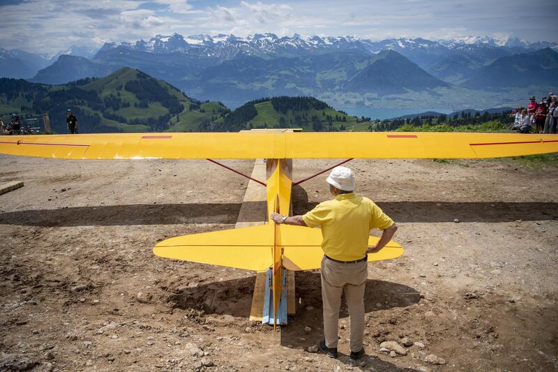 A glider ready for take-off above Lake Lucerne, Switzerland. Eleven historical gliders, mostly from the 40s and 50s, flew with the help of an elastic band at the weekend.  EPA