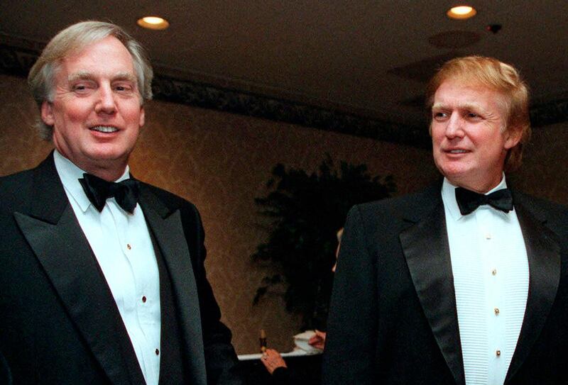 Robert Trump joins Donald Trump at an event in New York, Nov. 3, 1999. AP Photo