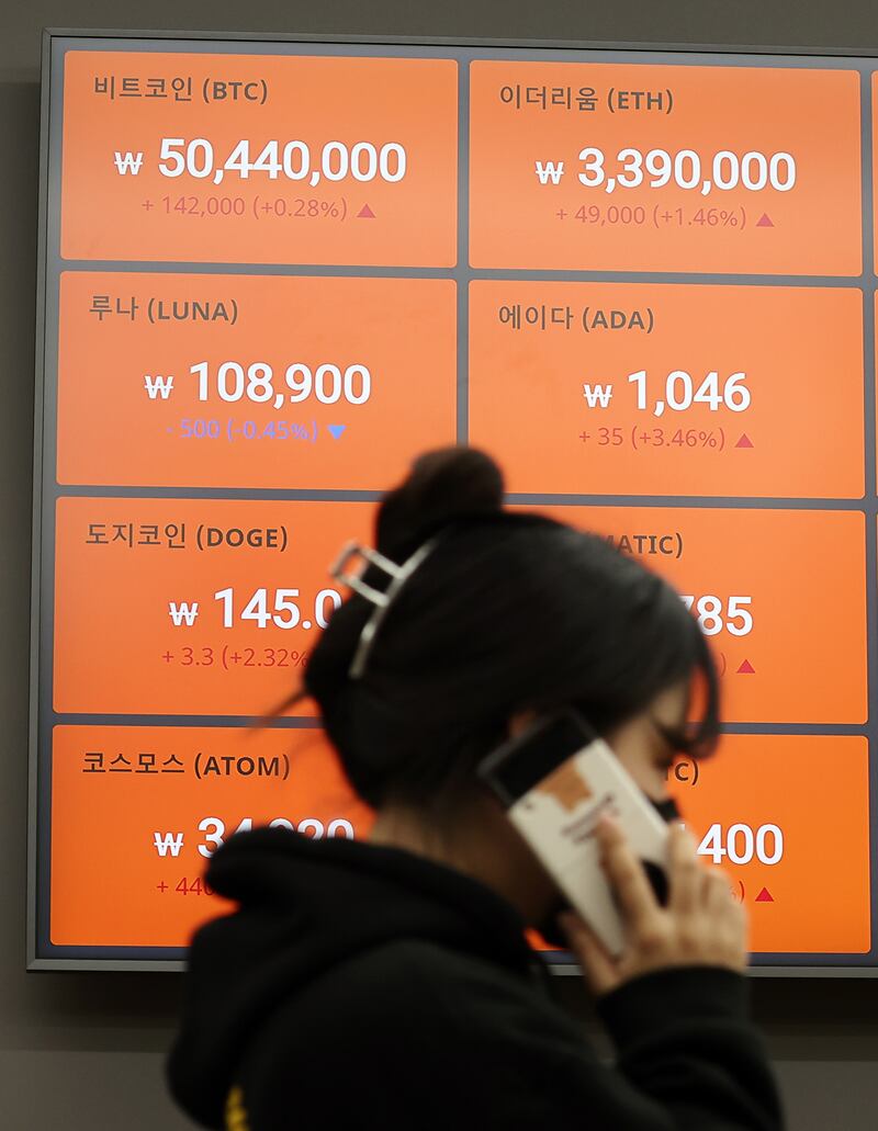 An electronic board of a cryptocurrency exchange in Seoul, South Korea, shows the bitcoin price recovering a 50 million won ($41,118) line during a session in March. EPA