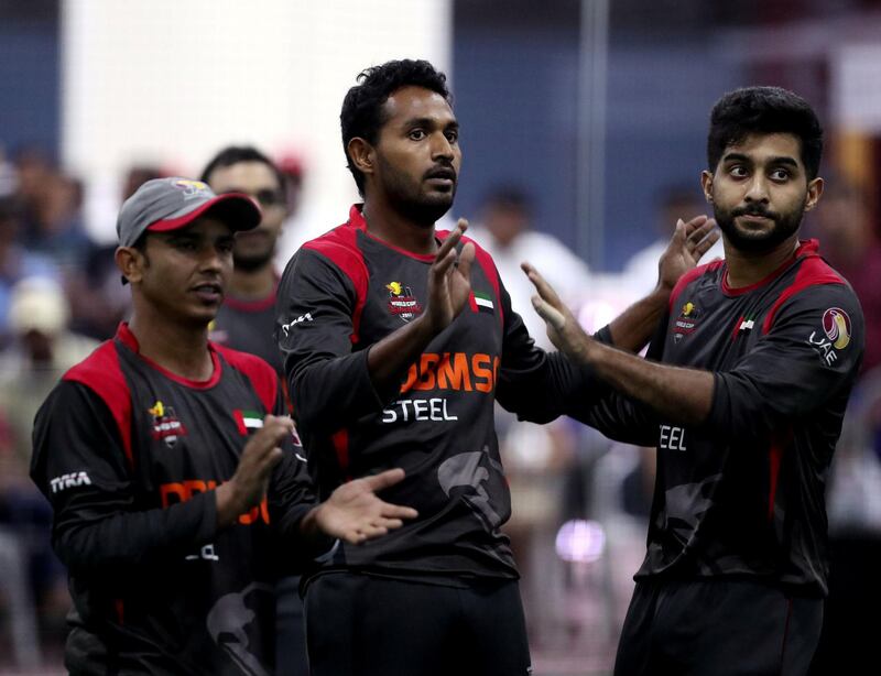 Dubai, United Arab Emirates - September 19th, 2017: Isuru Umesh (M) of the UAE takes a wicket during the game between the UAE v Sri Lanka in the W.I.C.F Indoor cricket world cup 2017. Tuesday, Sept 19th, 2017, Insportz, Al Quoz, Dubai. Chris Whiteoak / The National