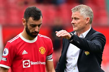 Manchester United's Norwegian manager Ole Gunnar Solskjaer consoles Manchester United's Portuguese midfielder Bruno Fernandes after he missed a penalty during the English Premier League football match between Manchester United and Aston Villa at Old Trafford in Manchester, north west England, on September 25, 2021.  (Photo by Paul ELLIS / AFP) / RESTRICTED TO EDITORIAL USE.  No use with unauthorized audio, video, data, fixture lists, club/league logos or 'live' services.  Online in-match use limited to 120 images.  An additional 40 images may be used in extra time.  No video emulation.  Social media in-match use limited to 120 images.  An additional 40 images may be used in extra time.  No use in betting publications, games or single club/league/player publications.   /  
