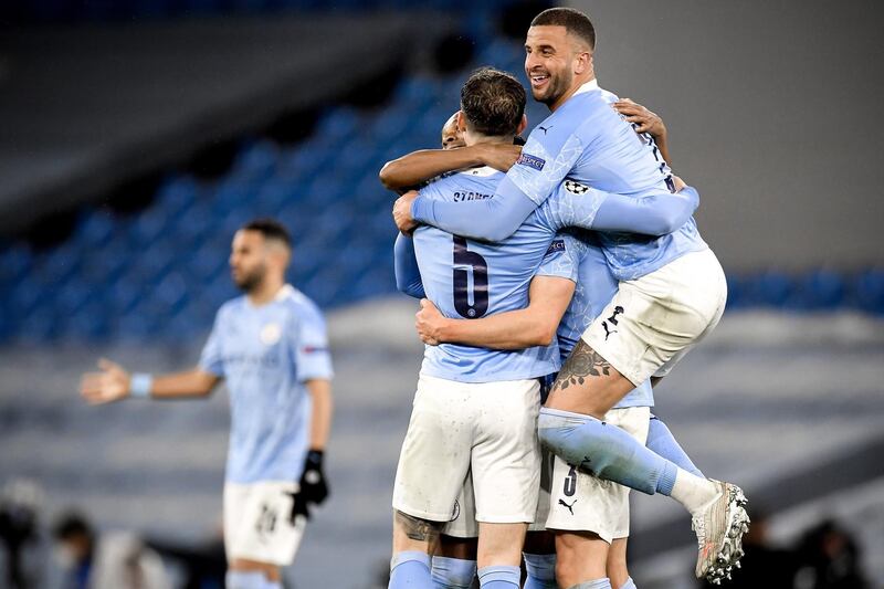 City's Kyle Walker, right, and his teammates celebrate after winning the Champions League semi final, second leg against Paris Saint-Germain. Next up, the Champions League final in Istanbul on May 29. EPA