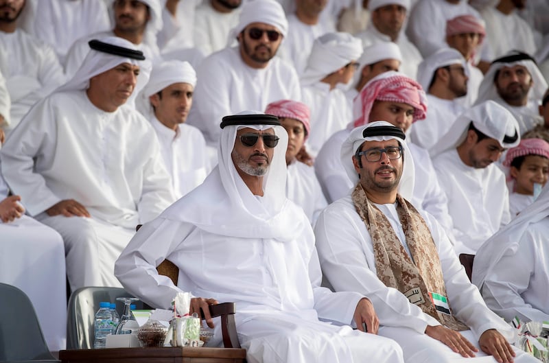 Sheikh Diab bin Zayed (C), speaks with Sheikh Mohamed bin Hamad (L), during the graduation ceremony for summer course volunteer cadets at Sieh Al Hama military camp. Rashed Al Mansoori / Crown Prince Court - Abu Dhabi 
