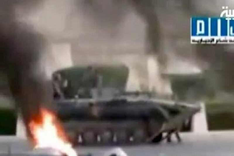 epa02849779 A TV grab taken from Al Arabiya channel on 31 July 2011 shows flames rising next to a military vehicle, at an unspecified location in Syria. According to media sources, at least 62 people were killed on 31 July when Syrian troops intensified their crackdown on pro-democracy protesters in the central city of Hama, in the eastern city of Deir el-Zour, six people were killed when tanks stormed al-Joura district early 31 July. Local human rights advocates say that more than 1,500 civilians have been killed since protests calling for the ouster of President Bashar al-Assad began in mid-March, over 350 security personnel have also been killed.  EPA/AL ARABIYA / HANDOUT BEST QUALITY AVAILABLE HANDOUT EDITORIAL USE ONLY/NO SALES *** Local Caption ***  02849779.jpg