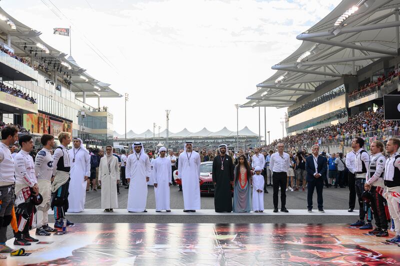 Dignitaries and Formula One officials stand for the national anthem before the race: Photo: Abdulla Al Neyadi /  UAE Presidential Court