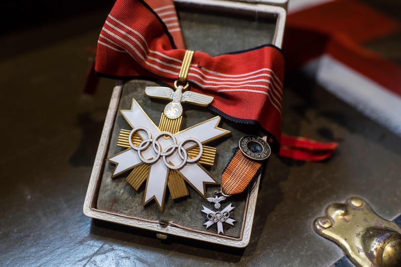 A first-class badge of honour from the 1936 Olympic Games is pictured on November 20, 2019, at the Hermann Historica auction house near Munich. AFP