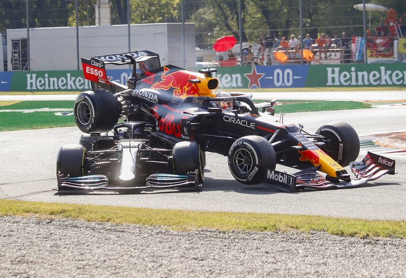 The Red Bull of Max Verstappen is wedged on top of Lewis Hamilton's Mercedes during the Italian Grand Prix on Sunday, September 12. EPA