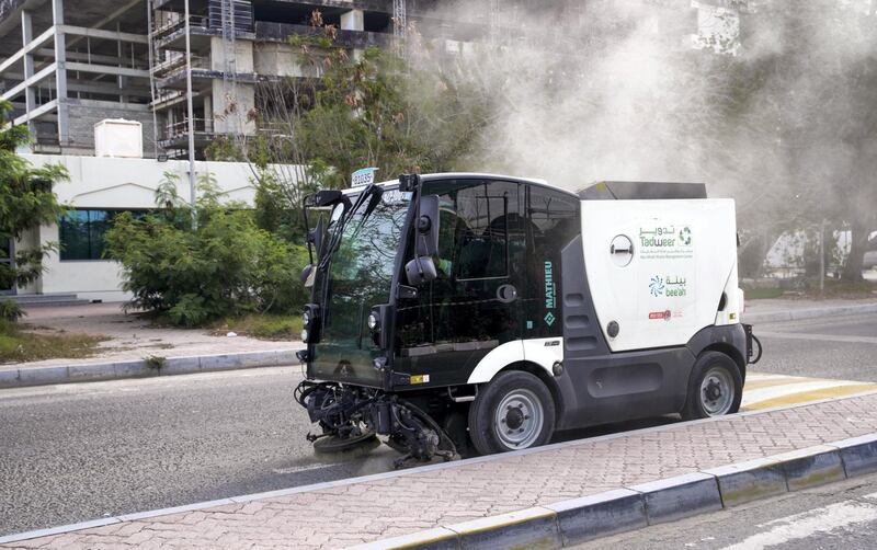 Abu Dhabi, United Arab Emirates, March 27, 2020.  A Tadweer stret sweeper vehicle in action at the Plant Market on the first day of the UAE cleaning campaign.  Emiratis and residents across the UAE must stay home this weekend while a nationwide cleaning and sterilisation drive is carried out. 
Victor Besa / The National