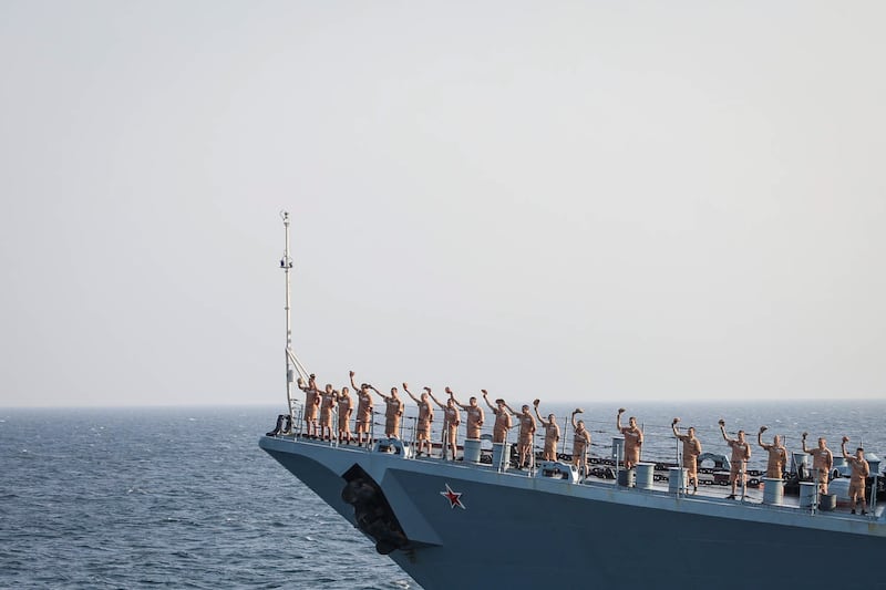 Russian sailors hail another vessel during the naval exercise.