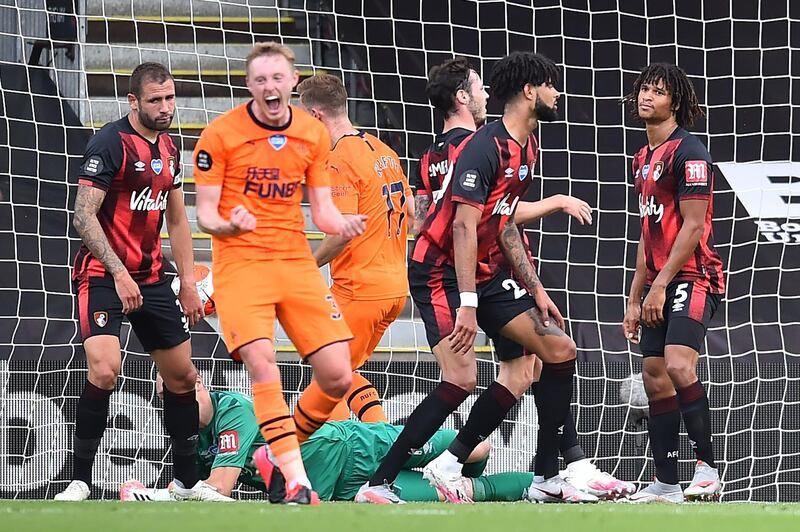 Newcastle United's English midfielder Sean Longstaff (C) celebrates after he scores his team's second goal during the English Premier League football match between Bournemouth and Newcastle United at the Vitality Stadium in Bournemouth, southern England on July 1, 2020. RESTRICTED TO EDITORIAL USE. No use with unauthorized audio, video, data, fixture lists, club/league logos or 'live' services. Online in-match use limited to 120 images. An additional 40 images may be used in extra time. No video emulation. Social media in-match use limited to 120 images. An additional 40 images may be used in extra time. No use in betting publications, games or single club/league/player publications.
 / AFP / POOL / Glyn KIRK                   / RESTRICTED TO EDITORIAL USE. No use with unauthorized audio, video, data, fixture lists, club/league logos or 'live' services. Online in-match use limited to 120 images. An additional 40 images may be used in extra time. No video emulation. Social media in-match use limited to 120 images. An additional 40 images may be used in extra time. No use in betting publications, games or single club/league/player publications.
