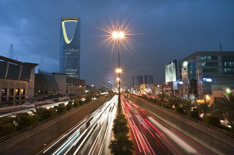 Vehicle light trails pass the Kingdom Tower on King Fahad Road in Riyadh, Saudi Arabia. The Saudi stock index is down 2.37 per cent for the year. Waseem Obaidi / Bloomberg